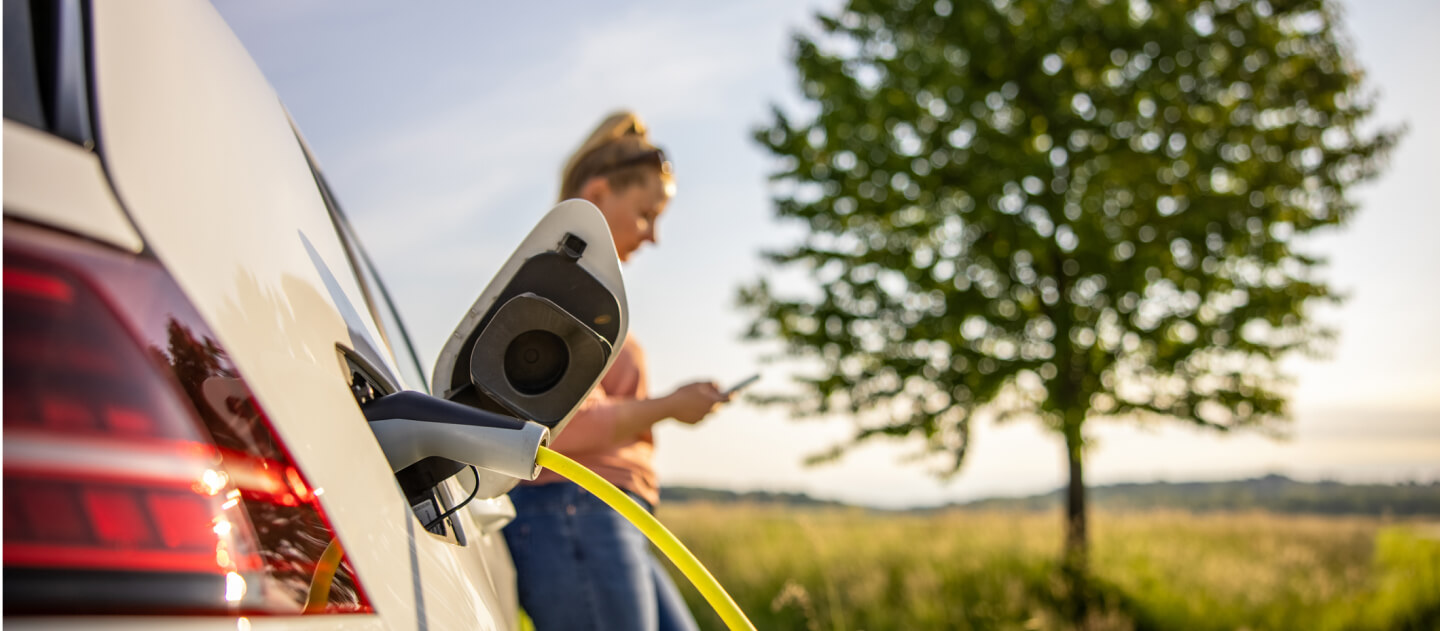 A woman charging a car