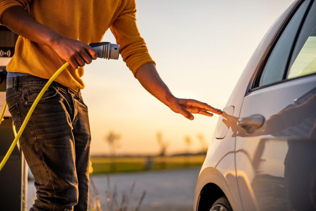 The man plugged the car into charging