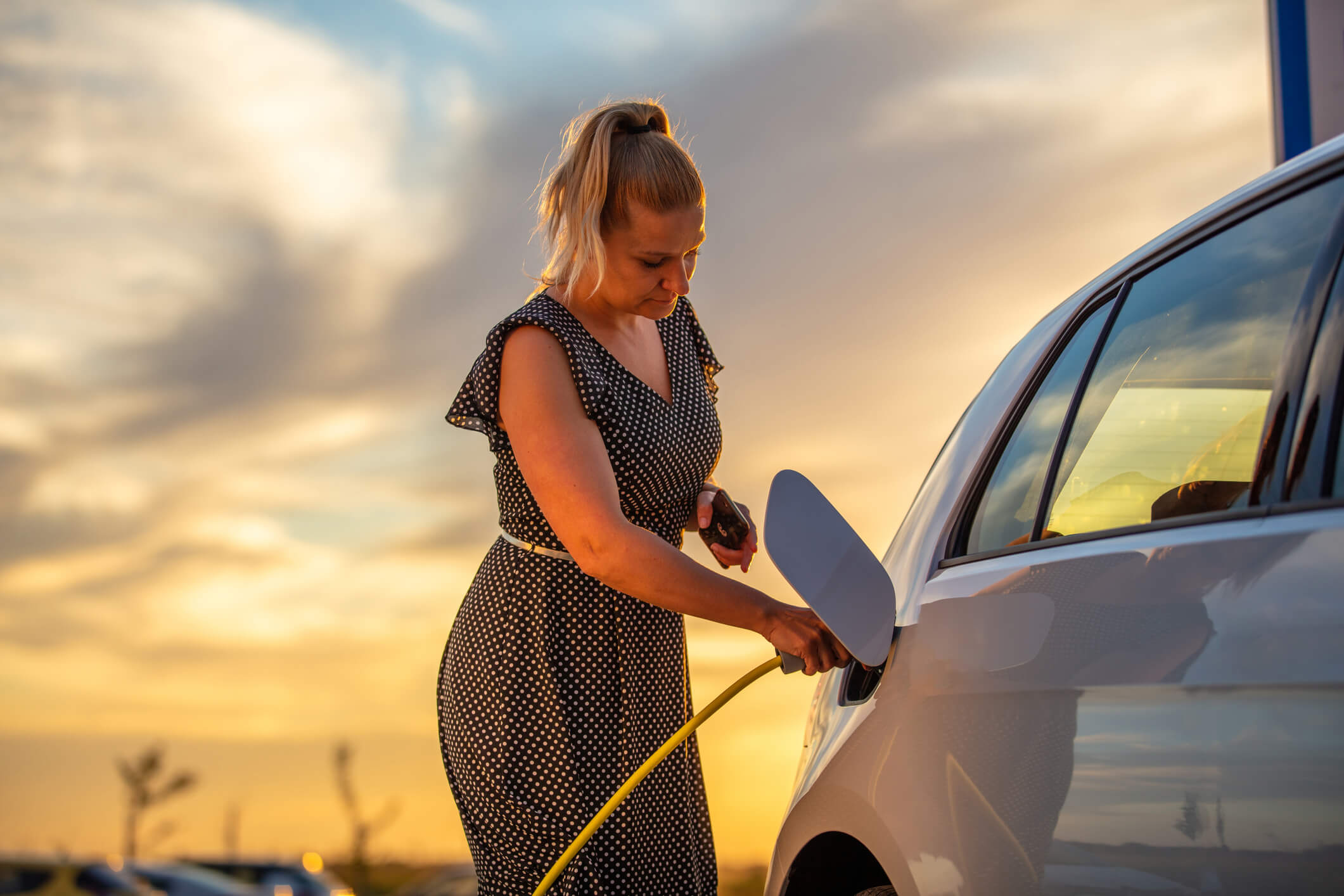 Woman charging the car