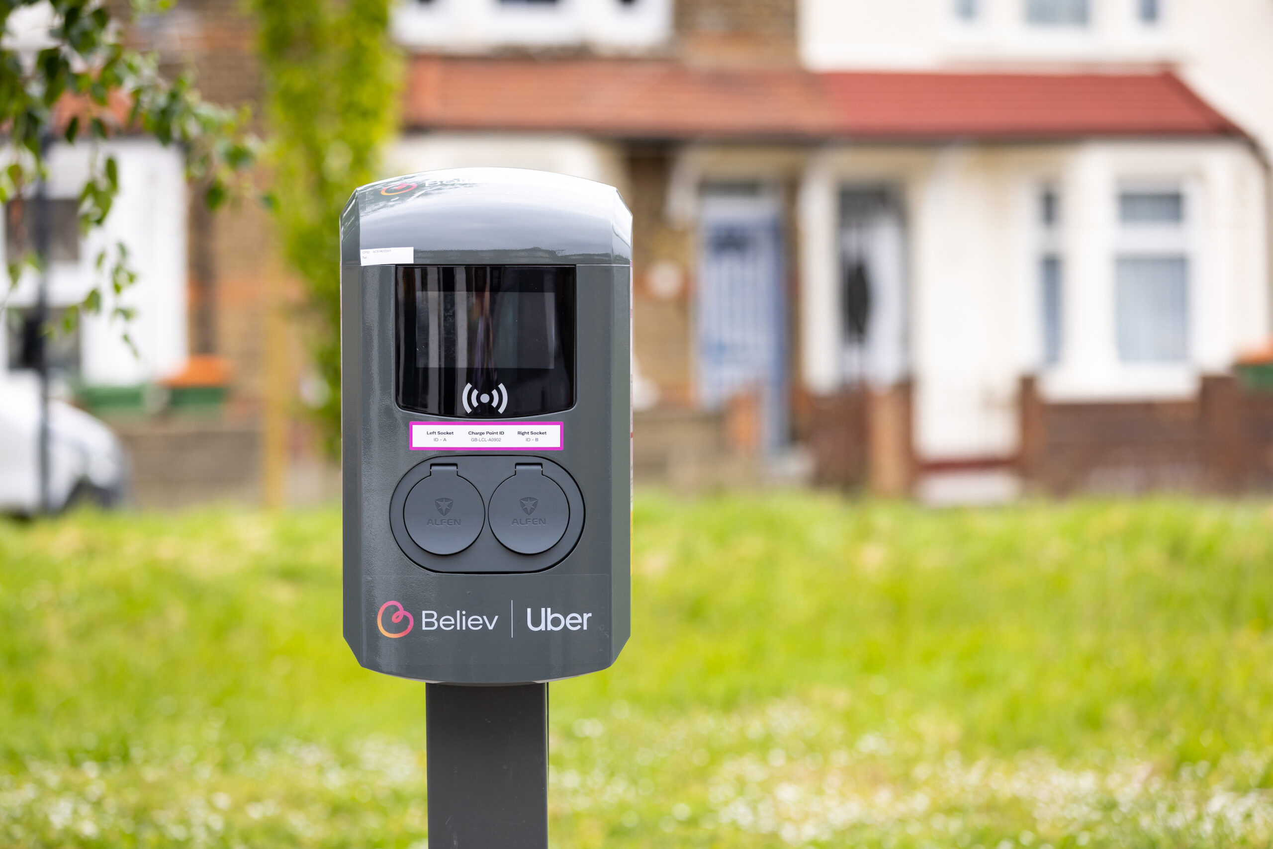 Believ PR Shoot - EV charge point with Believ and Uber logos.